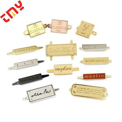 comprar Tendencia 2023 Mayorista Logotipo de metal de aleación de zinc personalizado Etiquetas Etiquetas de nombre para bolsas de alta calidad fabricación en línea