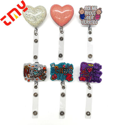 comprar Emblema retráctil de cuentas de costumbre Toppers de carrete divertidos Glitter de dibujos animados Sparkle Charms Enfermería médica Acrílico Flatback fabricación en línea